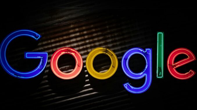 Google announces restructuring to accelerate AI initiatives Google logo neon sign as the company announces a restructuring of its divisions and leadership to accelerate its AI initiatives.