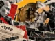 Editorial collage of workers patching a damaged wall beside server racks, with a robot, Bitcoin symbol, and PHP code.